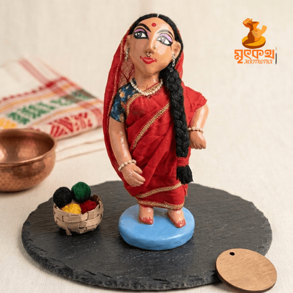 লাল শাড়ি পরা পল্লীবধূ